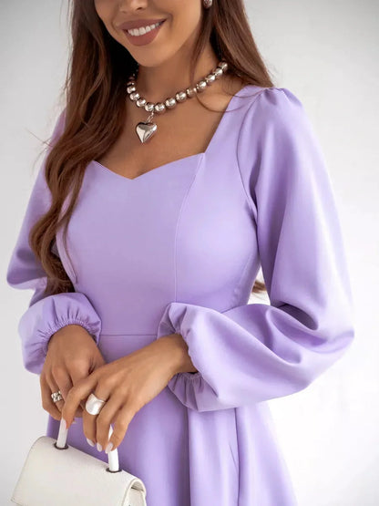 Model wearing a Lilac Mini Dress by Lauven featuring a sweetheart neckline and puff sleeves.