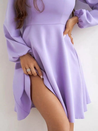 Lilac Mini Dress by Lauven, showcasing a flared skirt and long sleeves, perfect for cocktail occasions.