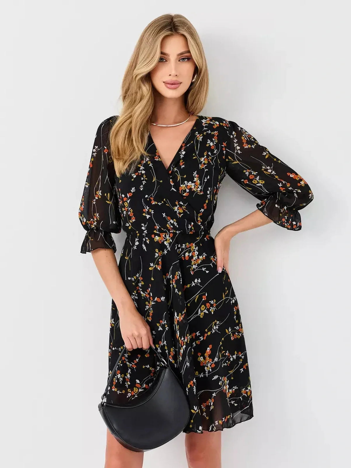 Lotus Mini Dress by Lauven, black floral wrap dress with deep V-neck and 3/4 puff sleeves