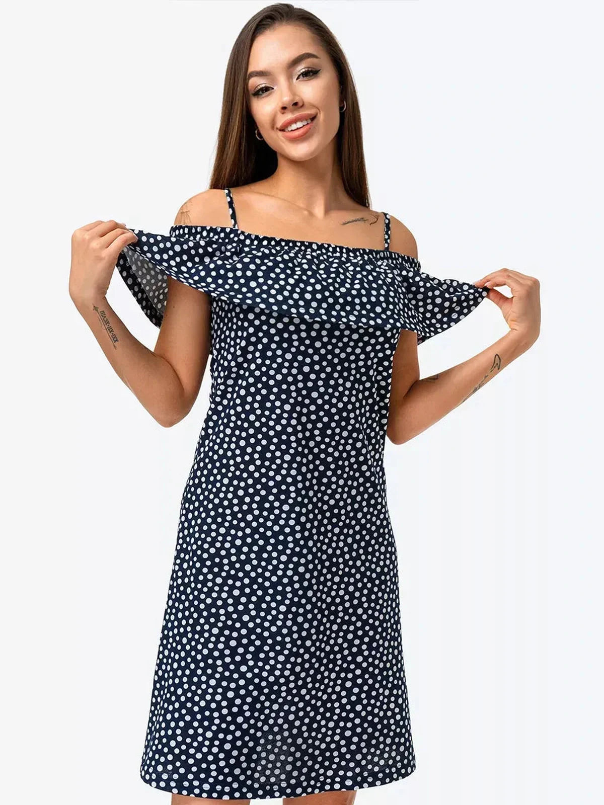 Lucy Mini Dress by Lauven in navy polka dot cotton with off-shoulder ruffle, perfect for day-to-night style.