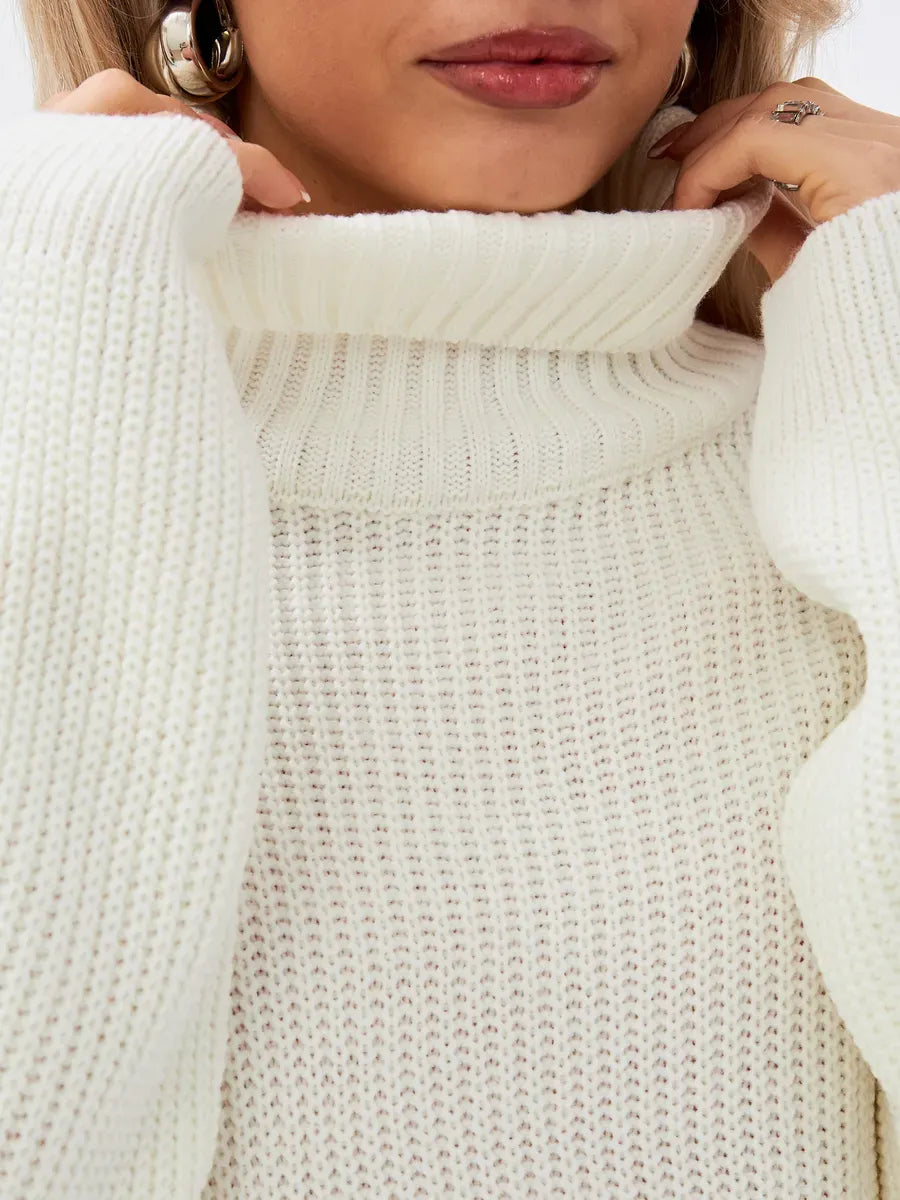 Lyra Sweater by Lauven - Oversized knit high neck in soft ivory, showcasing elegance and comfort.