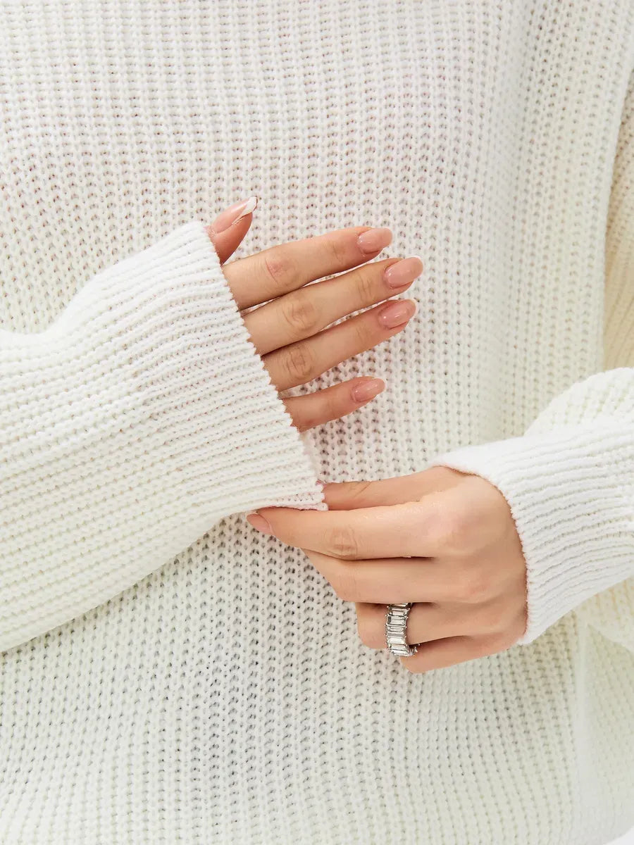 Lyra Sweater by Lauven featuring oversized knit design and soft ivory color, showcasing cozy high-neck detail.