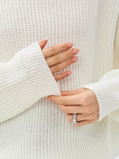 Lyra Sweater by Lauven featuring oversized knit design and soft ivory color, showcasing cozy high-neck detail.