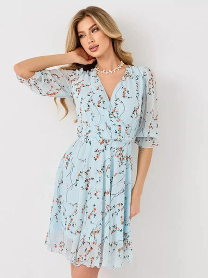 Mara Mini Dress - Lauven light blue floral wrap dress with 3/4 sleeves and elasticated waist.