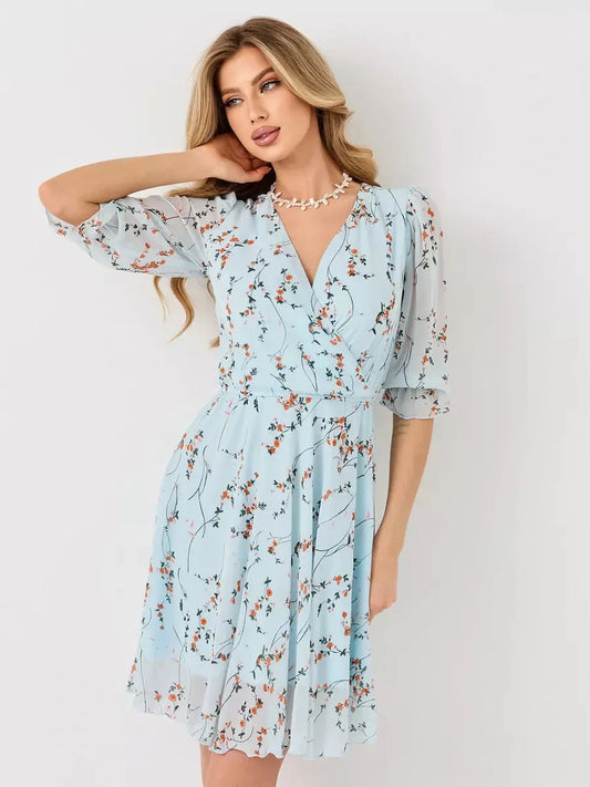 Mara Mini Dress - Lauven light blue floral wrap dress with 3/4 sleeves and elasticated waist.