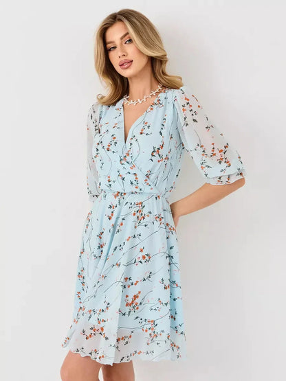 Mara Mini Dress by Lauven - Light blue floral wrap dress with V-neckline and 3/4 sleeves.