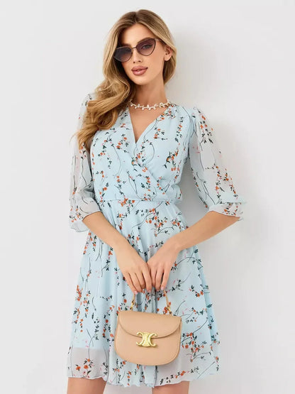 Mara Mini Dress by Lauven - Light blue floral wrap dress with 3/4 sleeves and A-line silhouette.