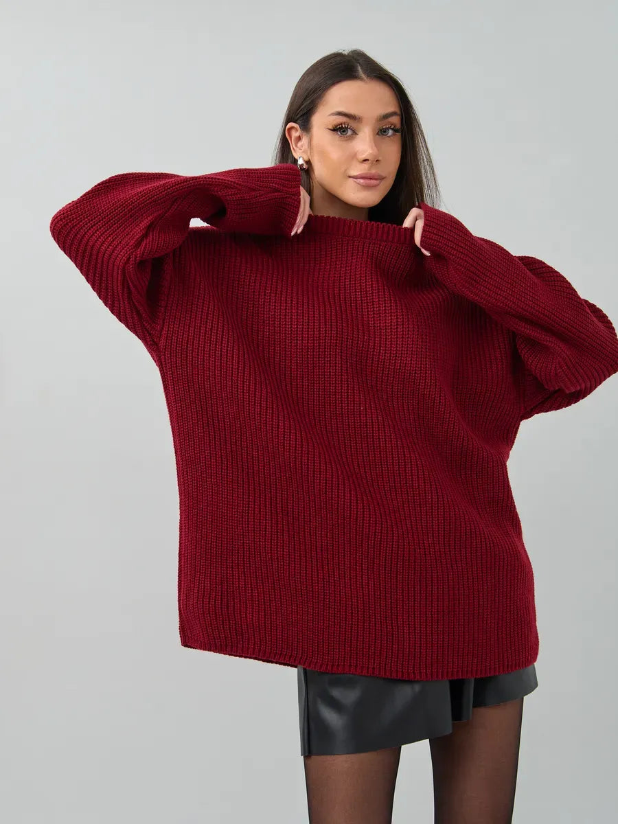 Model wearing oversized Maribel Sweater by Lauven in rich burgundy knit with a relaxed silhouette.
