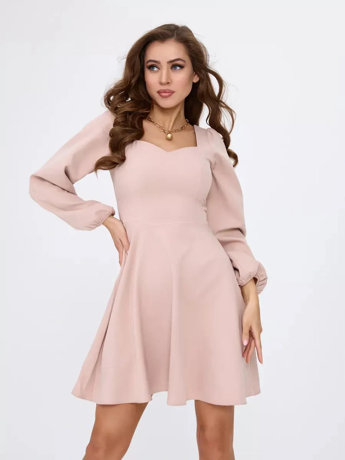Milanese Mini Dress by Lauven in blush pink, featuring a fitted bodice, A-line skirt, and long puff sleeves.