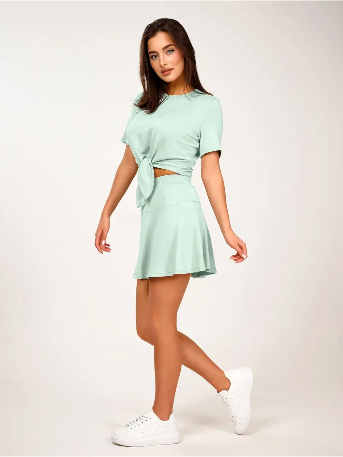 Mint Set – Mint green two-piece women’s suit with cropped tie-front top and flared mini skirt.