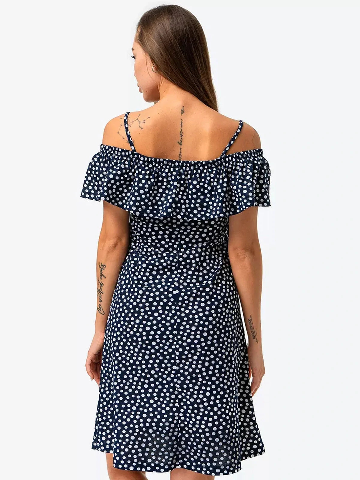 Lucy Mini Dress by Lauven in navy with white polka dots, showcasing an off-shoulder ruffle and flattering A-line silhouette.