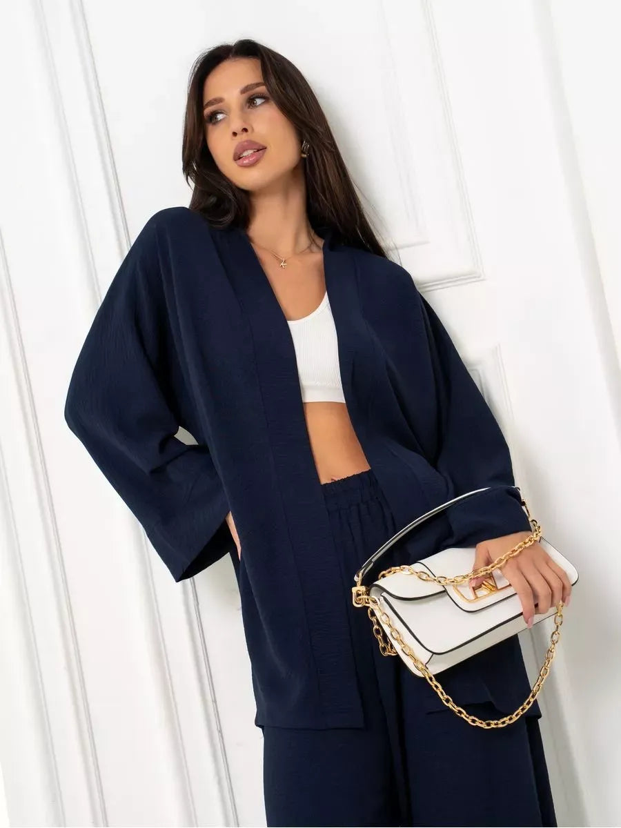 Model showcasing the Lauven Navy Suit Set, a stylish oversized two-piece in deep blue, featuring wide-leg trousers.