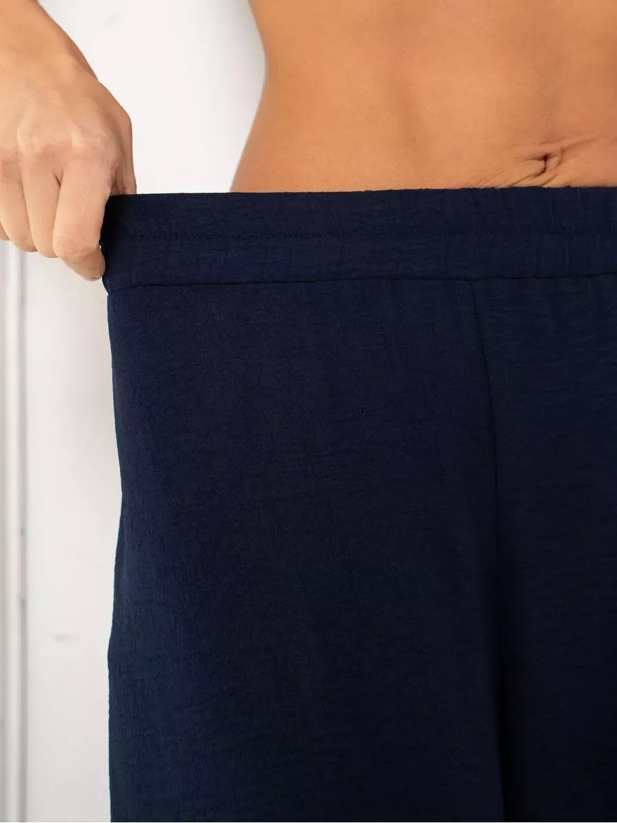 Navy Suit Set by Lauven featuring wide-leg trousers showcasing breathable fabric construction.