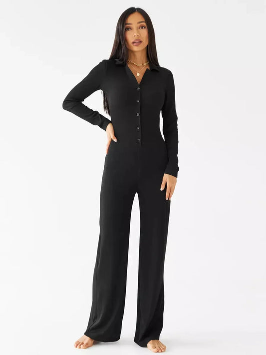 Nora Jumpsuit in black ribbed knit with button-front neckline, pointed collar, and wide-leg fit.