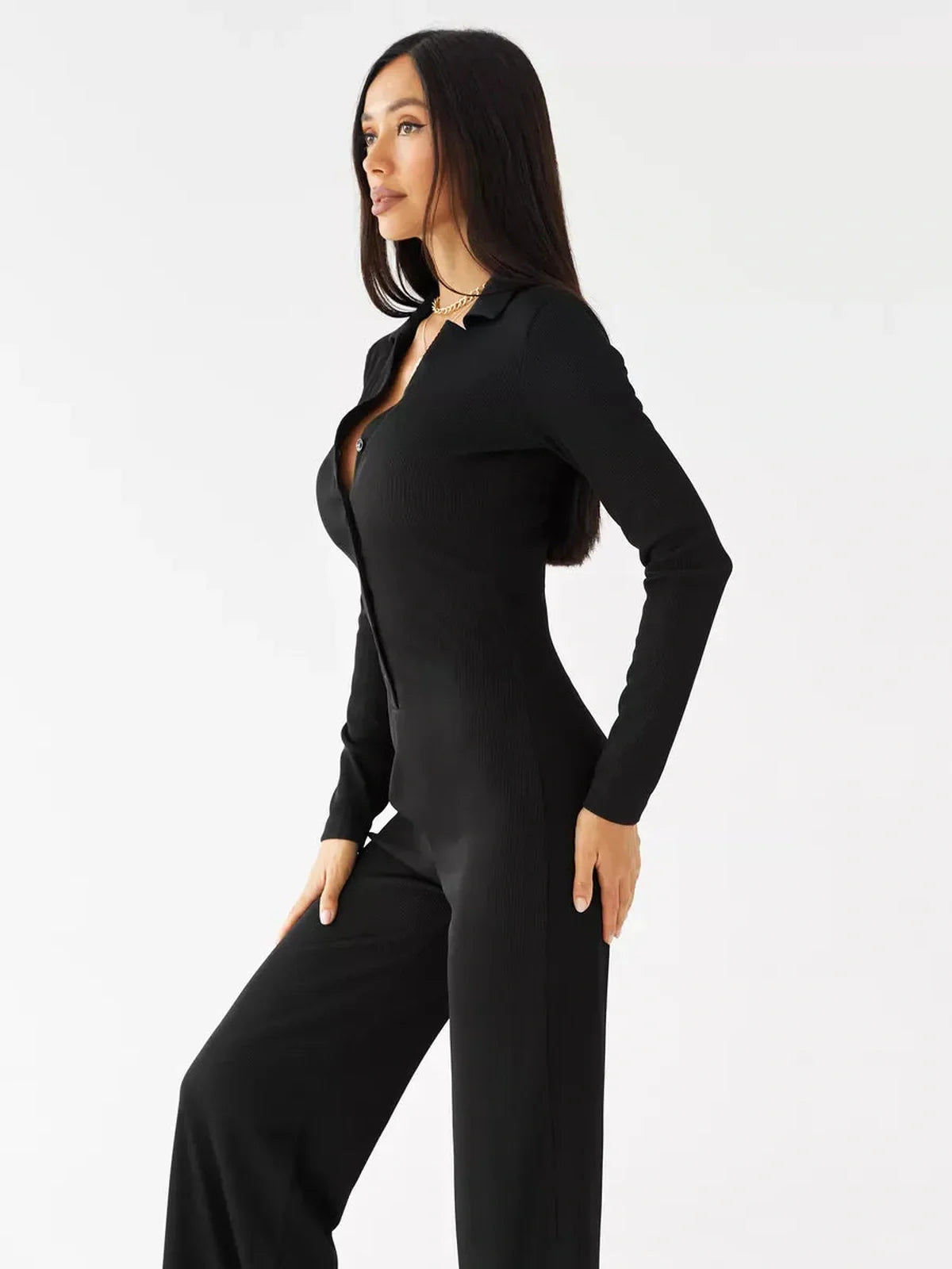 Nora Jumpsuit – Black ribbed knit wide-leg jumpsuit featuring a classic collar and button-front design.