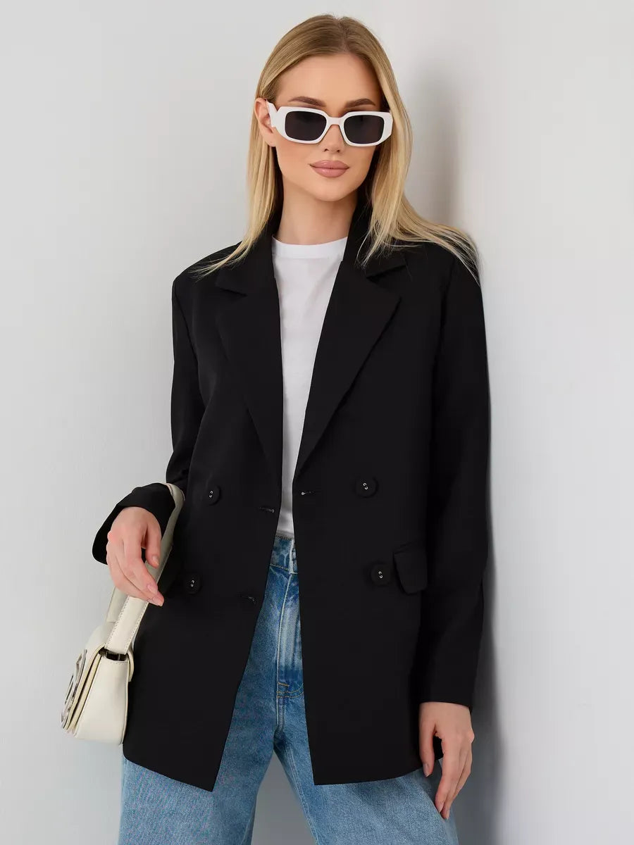Model wearing the Nova Blazer by Lauven, a sleek oversized black double-breasted women's blazer.