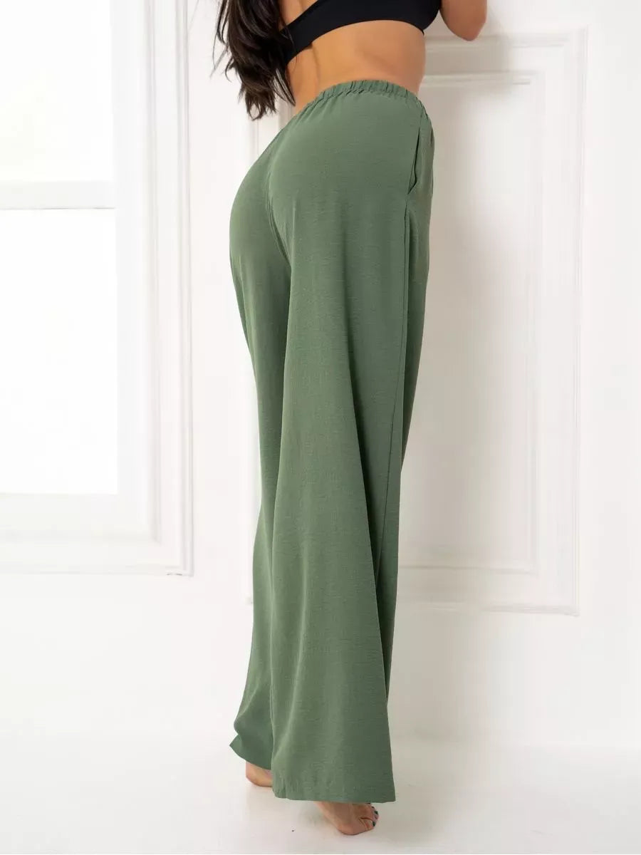 Olive Suit Set - Rear view of wide-leg trousers in soft green from Lauven, featuring a relaxed fit and side pockets.