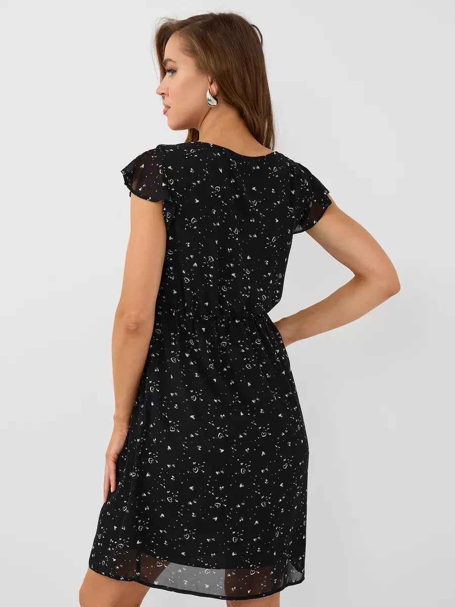 Onyx Mini Dress by Lauven, elegant black ruffle sleeve dress showcasing fitted silhouette and floral detail.