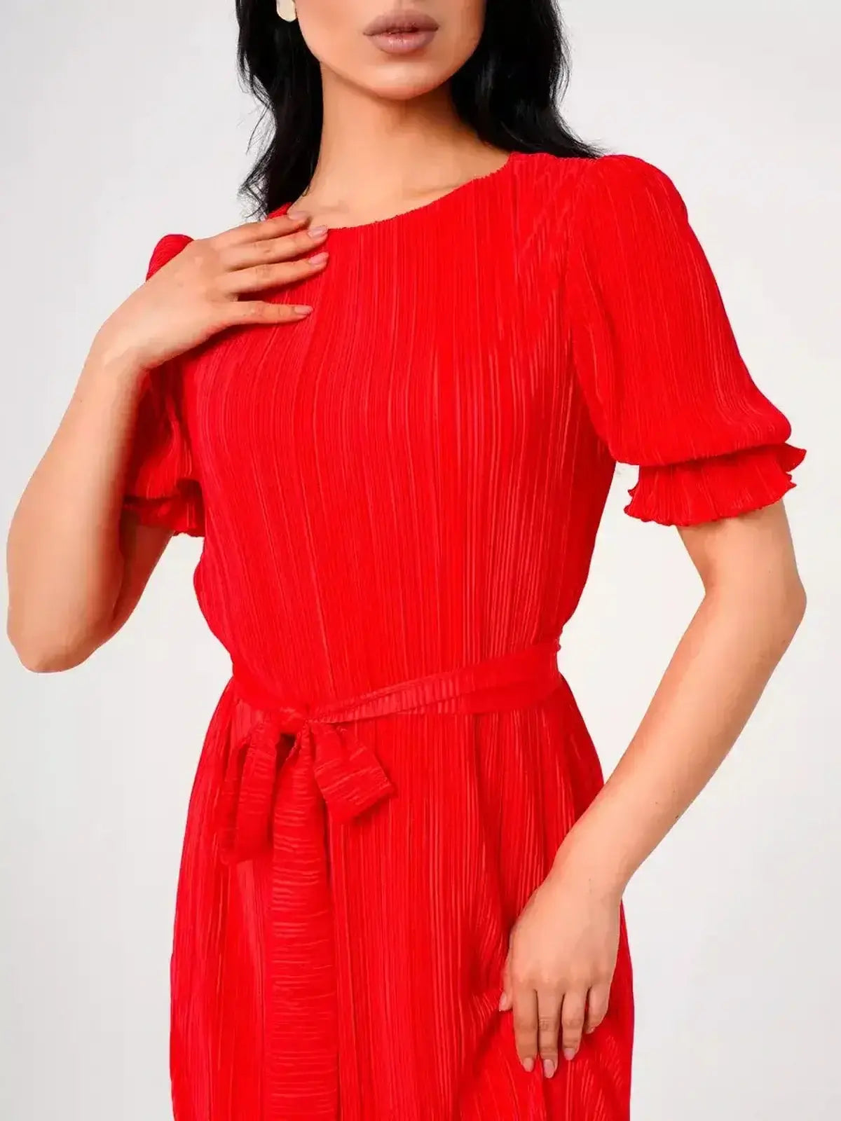 Ophelia Maxi Dress featuring a pleated design, vibrant red color, and a belted waist for a flattering silhouette.