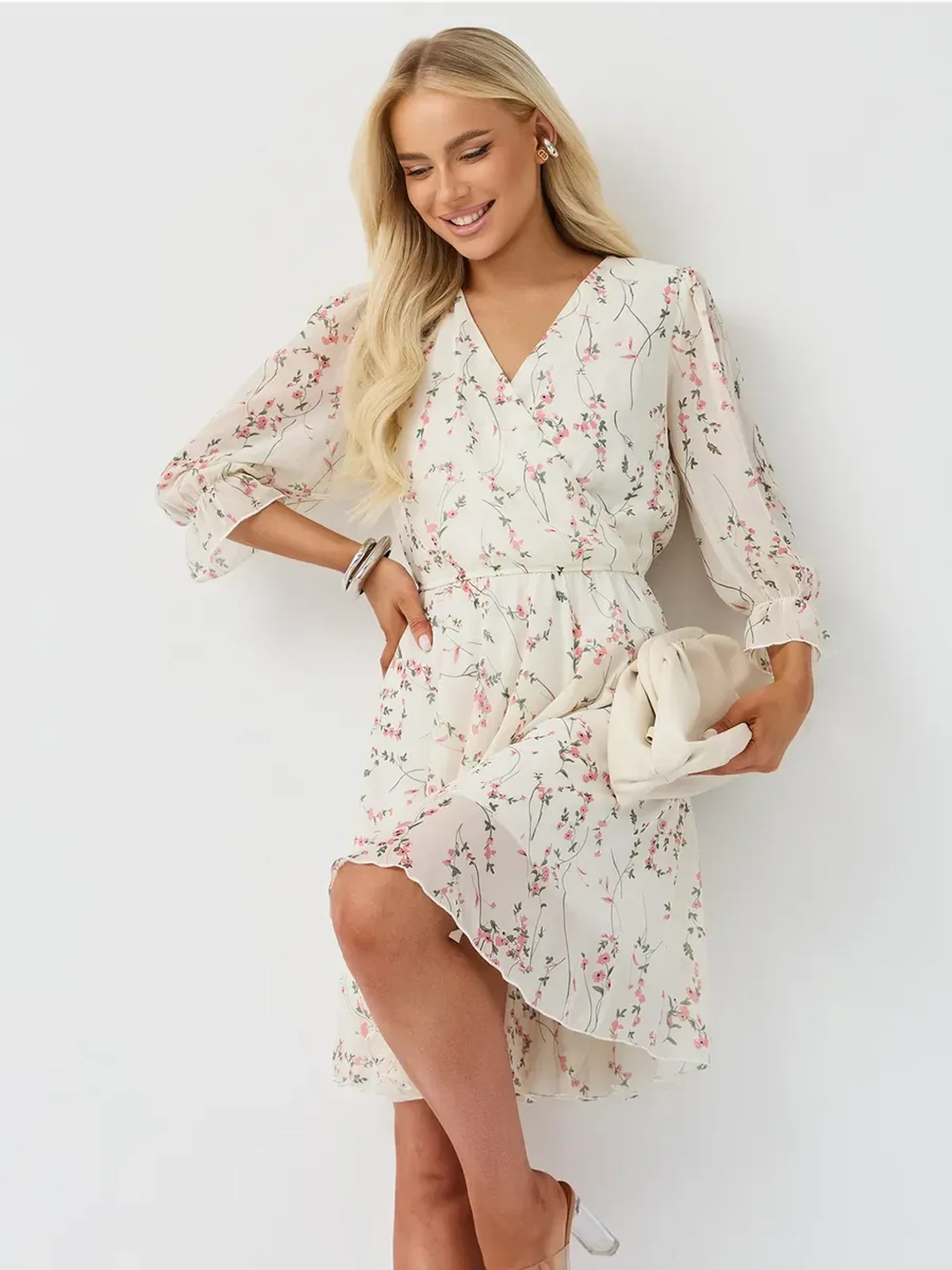 Petunia Mini Dress by Lauven featuring a floral wrap design, V-neckline, and three-quarter sleeves.