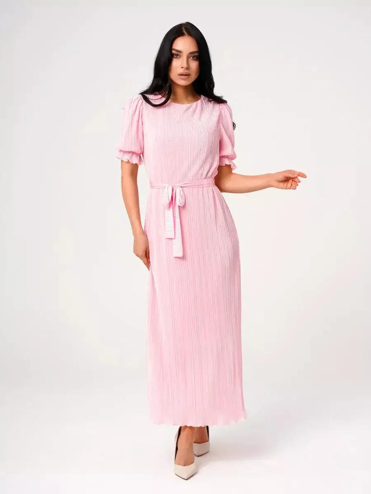 Candy Maxi Dress in pink with pleated design, puff sleeves, and tie waist, showcasing elegance and femininity.