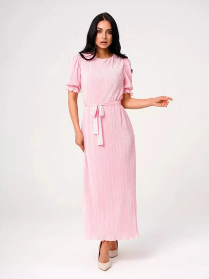 Candy Maxi Dress in pink with pleated design, puff sleeves, and tie waist, showcasing elegance and femininity.