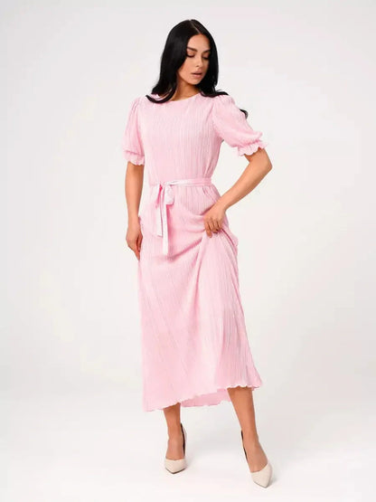 Candy Maxi Dress featuring pleated elegance, puff sleeves, and a tie waist in a soft pink color.