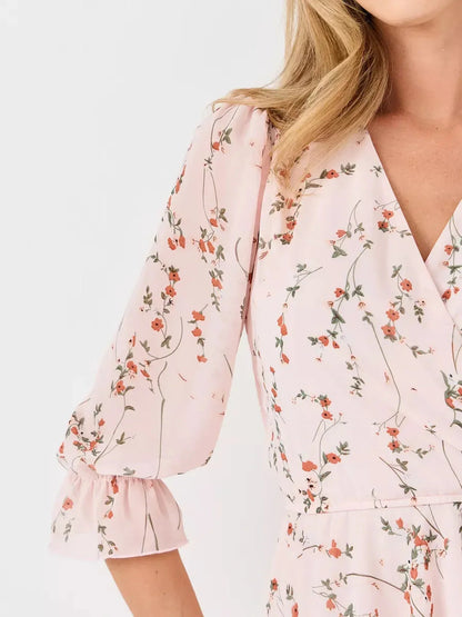 Primrose Mini Dress by Lauven - Close-up of pink floral design and 3/4 puff sleeves.