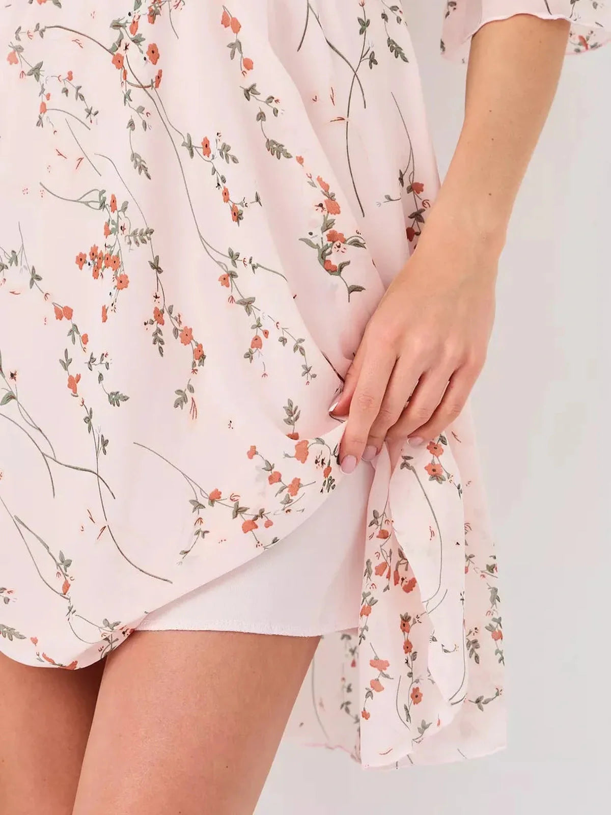 Primrose Mini Dress by Lauven, showcasing soft pink floral fabric with 3/4 puff sleeves and A-line silhouette.
