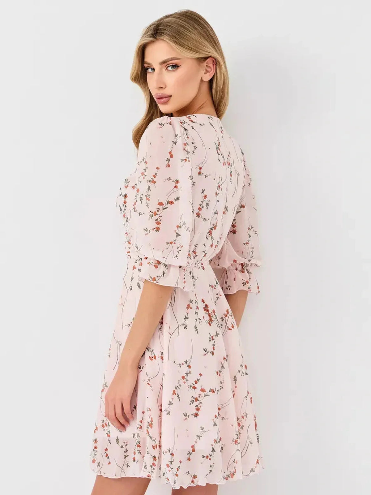 Primrose Mini Dress by Lauven - pink floral wrap dress with puff sleeves and A-line silhouette.
