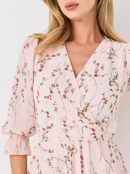 Primrose Mini Dress by Lauven, a pink floral wrap dress featuring a V-neckline and 3/4 puff sleeves.