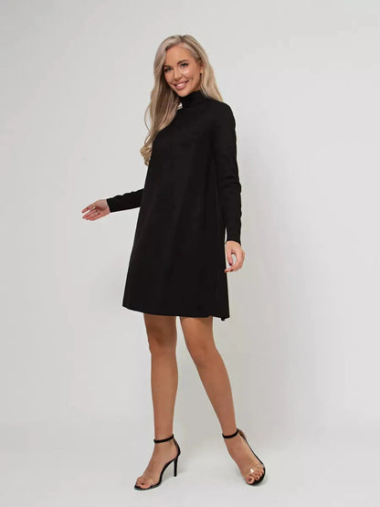 Model wearing Lauven Quinn Mini Dress, a black long sleeve A-line dress with a mock neck and back zip.