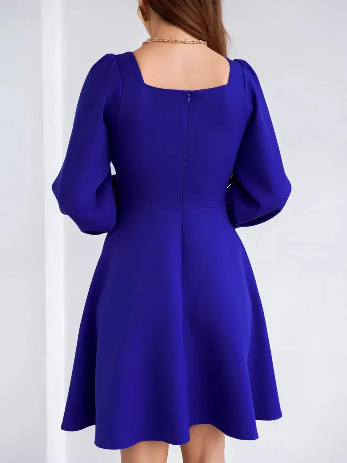 Royal Mini Dress by Lauven in vibrant blue, showcasing a fitted waist and flared skirt with long sleeves.