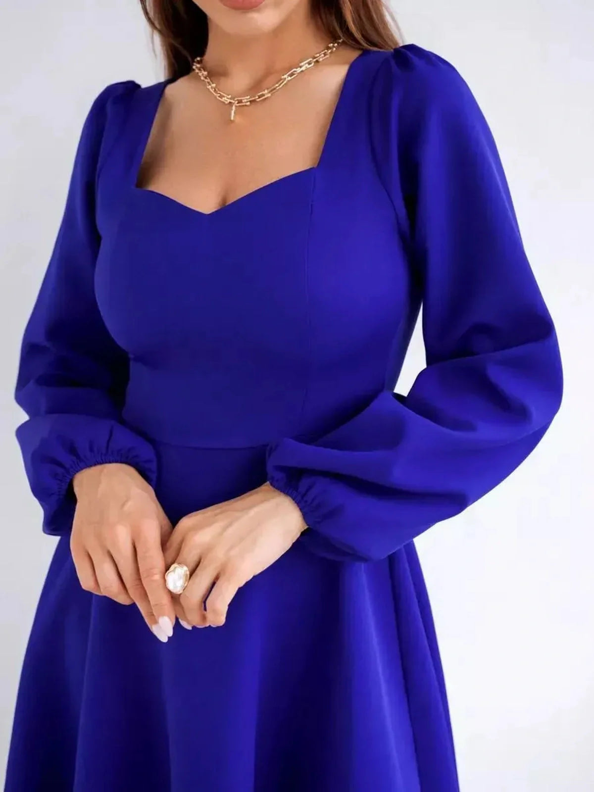 Royal Mini Dress by Lauven, featuring a sculpted square neckline and long puff sleeves in royal blue.