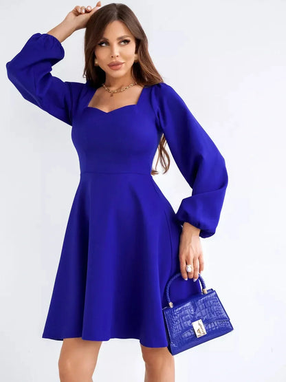 Royal Mini Dress by Lauven, featuring a sculpted square neckline and long sleeves in vibrant blue.