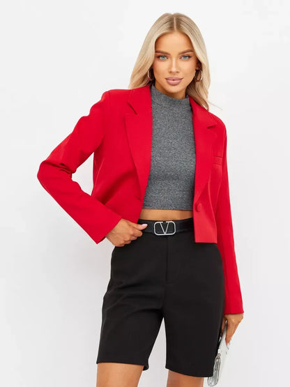 Ruby Blazer by Lauven worn with a gray top and black shorts, showcasing modern red elegance.