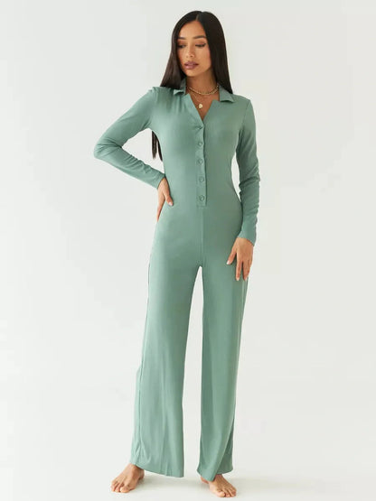 Model showcasing the Scarlett Jumpsuit in sage green, featuring a button-down placket and wide-leg design.