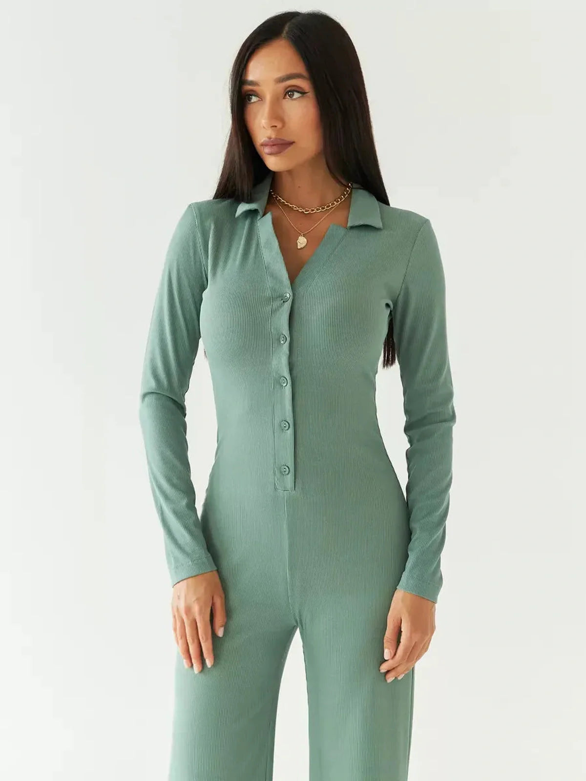 Scarlett Jumpsuit in sage green, featuring ribbed knit fabric, button-down front, and wide-leg silhouette.