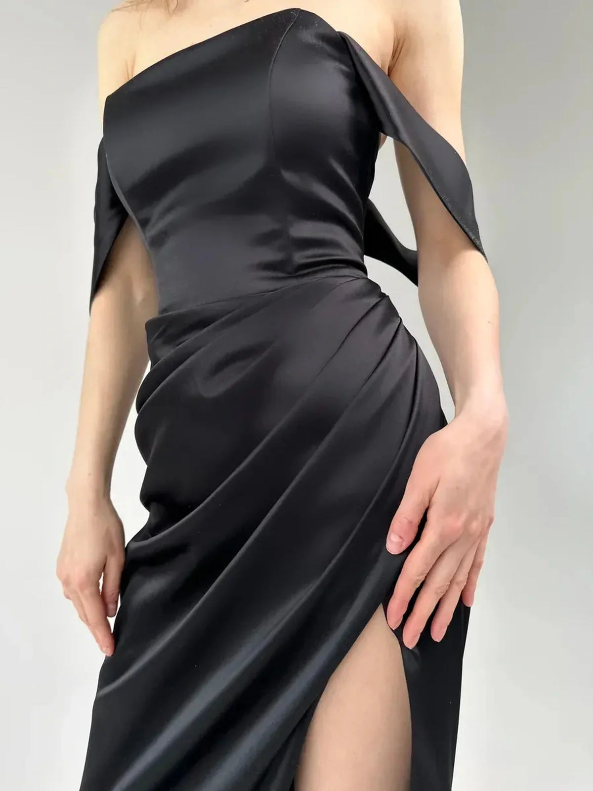 Selene Party Dress by Lauven - Off-shoulder satin gown with high slit featuring elegant draping and fitted silhouette.