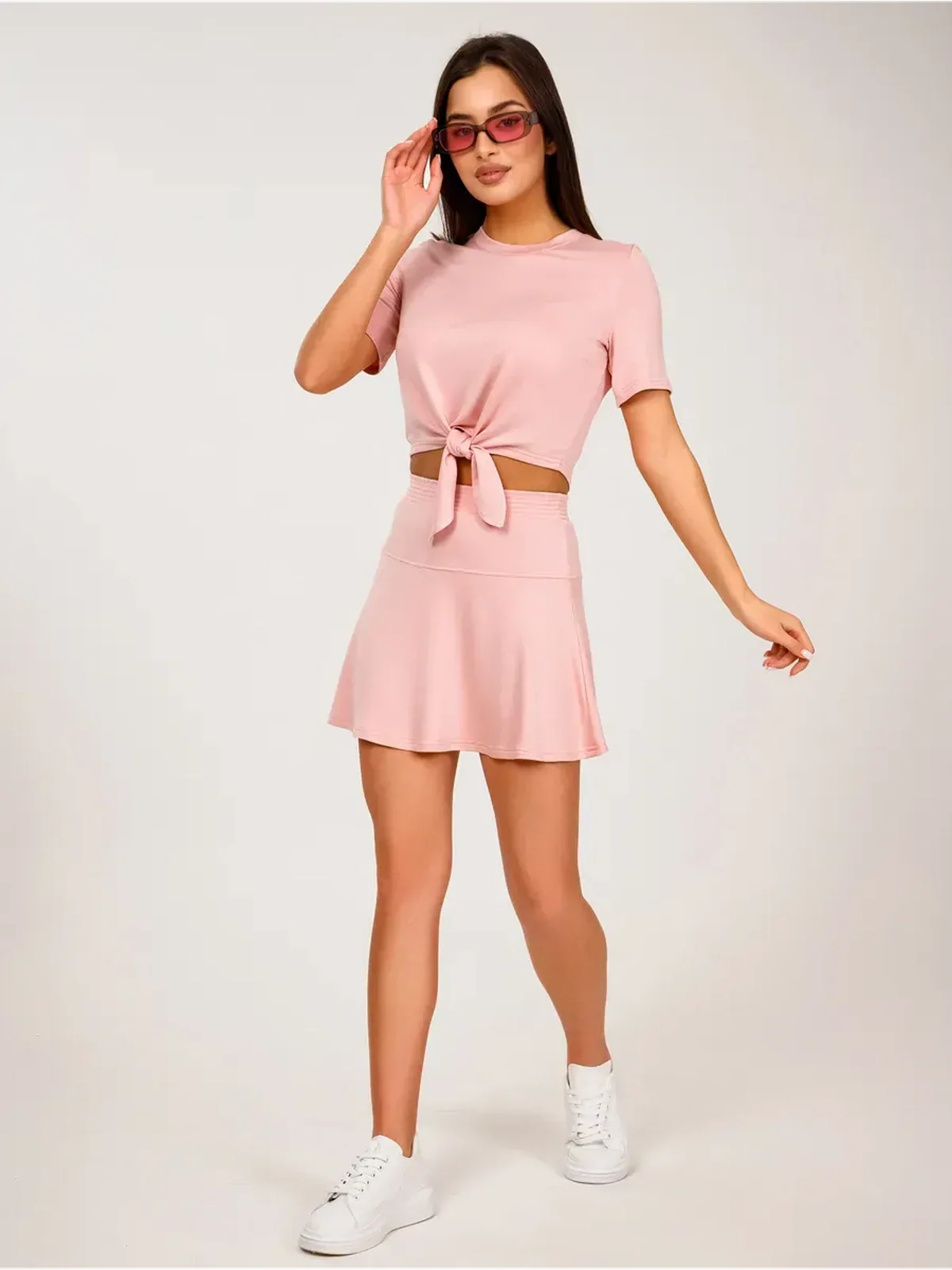 Serena Set women's two-piece pink cropped top with tie front and mini skirt, perfect for warm weather styling.