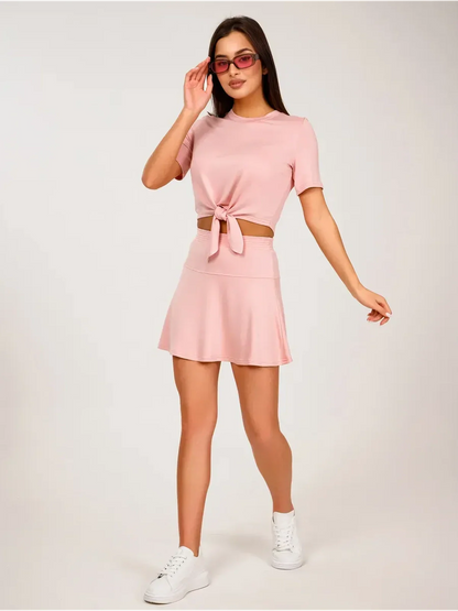 Serena Set women's two-piece pink cropped top with tie front and mini skirt, perfect for warm weather styling.