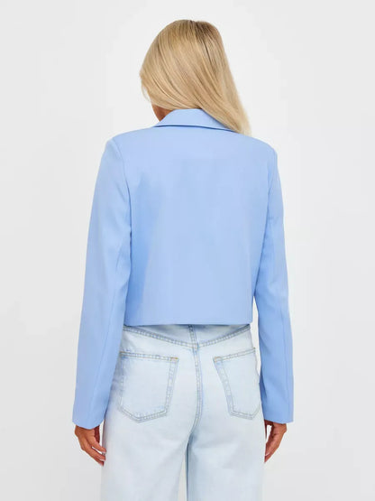 Back view of Skyline Blazer by Lauven, a cropped tailored classic in soft blue.