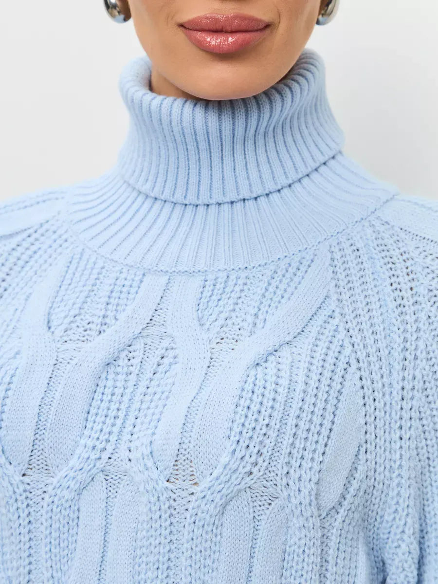 Skyline Knitwear by Lauven, women's wool-blend turtleneck sweater in soft pastel blue with cable-knit pattern.