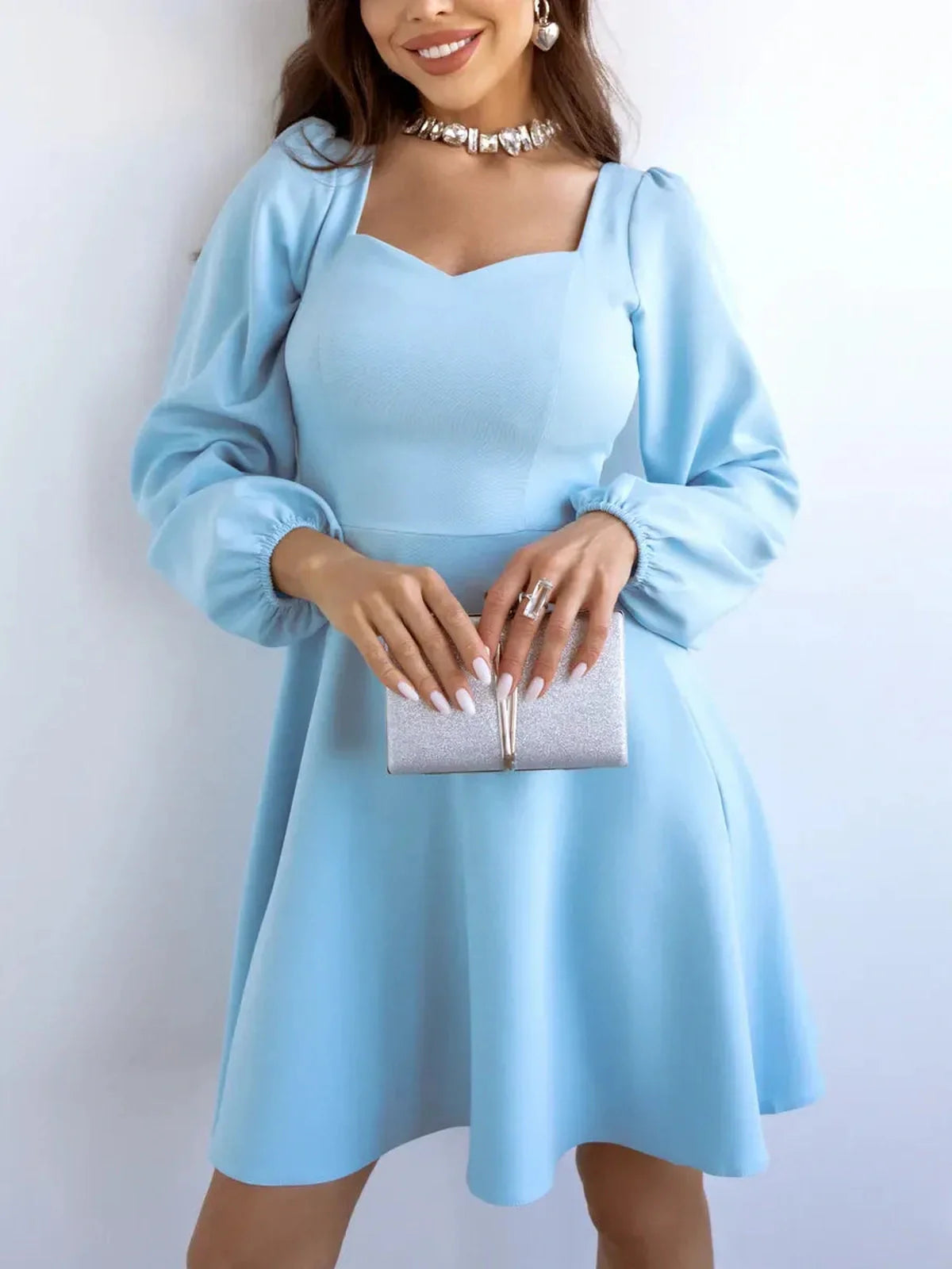 Skyline Mini Dress by Lauven in light blue, featuring long sleeves and a flared skirt, perfect for cocktail occasions.