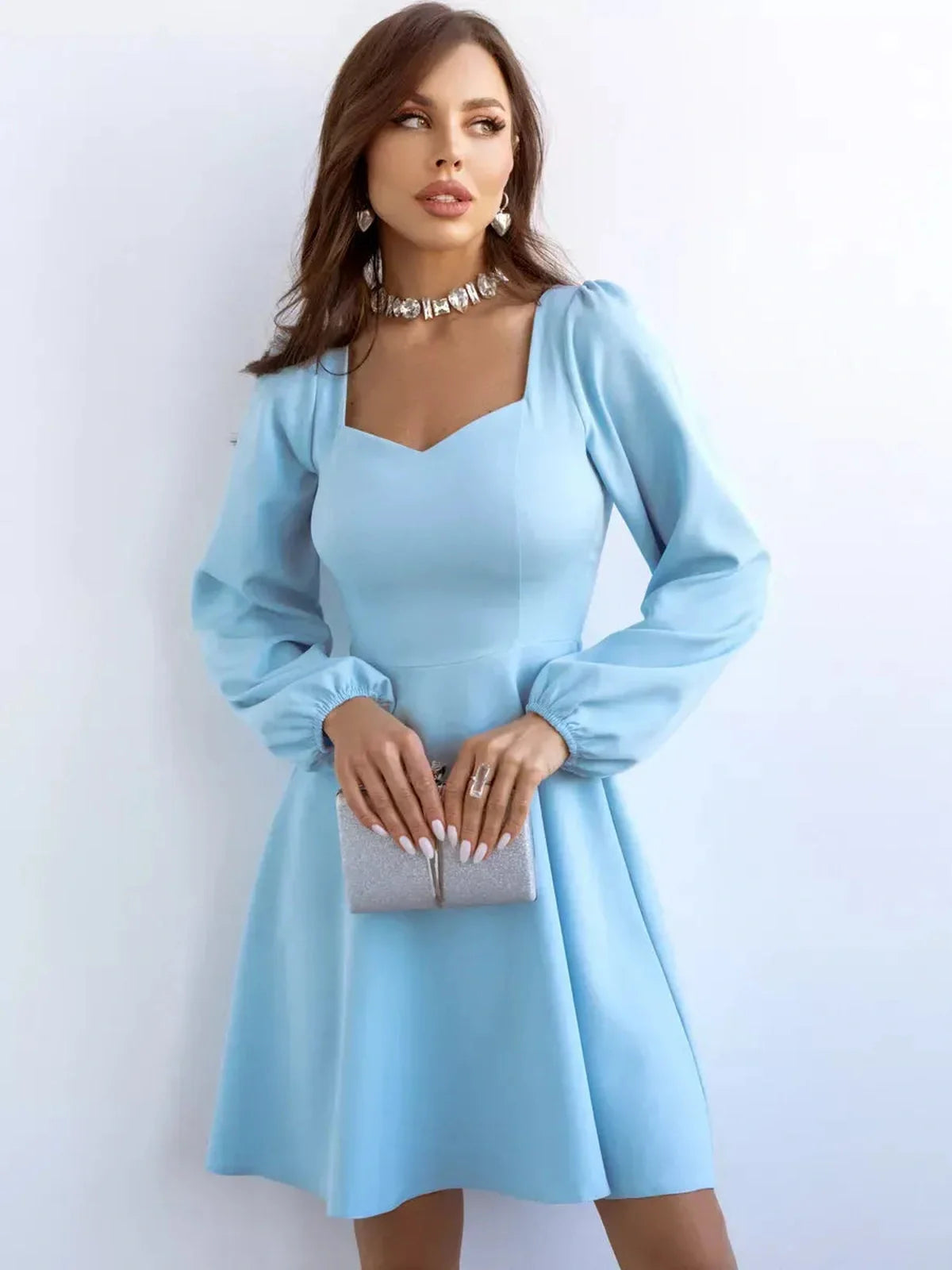 Skyline Mini Dress by Lauven in light blue with flared skirt and long sleeves, perfect for cocktail occasions.