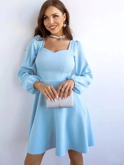 Skyline Mini Dress by Lauven in light blue with long sleeves and a flared skirt, featuring a square neckline.
