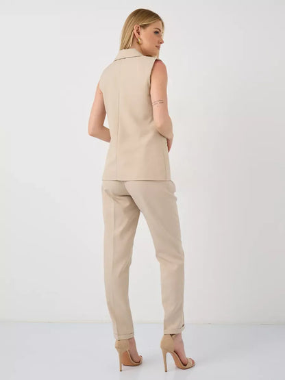 Solara Suit Set by Lauven, showcasing a sleeveless beige vest and high-waist pants from the back.