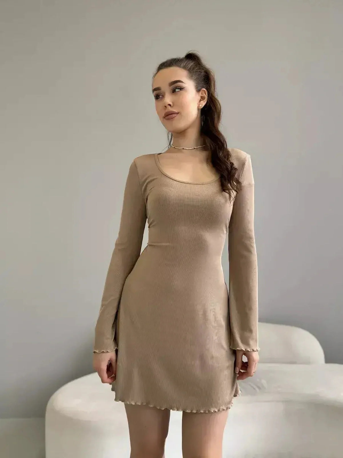 Sophia Mini Dress by Lauven in neutral ribbed knit with long sleeves and ruffled hem.