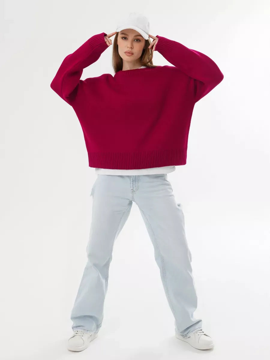Vela Pullover by Lauven, oversized cropped women's sweater in rich burgundy, paired with light denim for a stylish look.