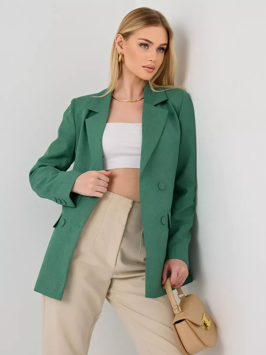 Model wearing a Verde Blazer by Lauven, an oversized double-breasted green tailored jacket paired with neutral high-waisted pants.